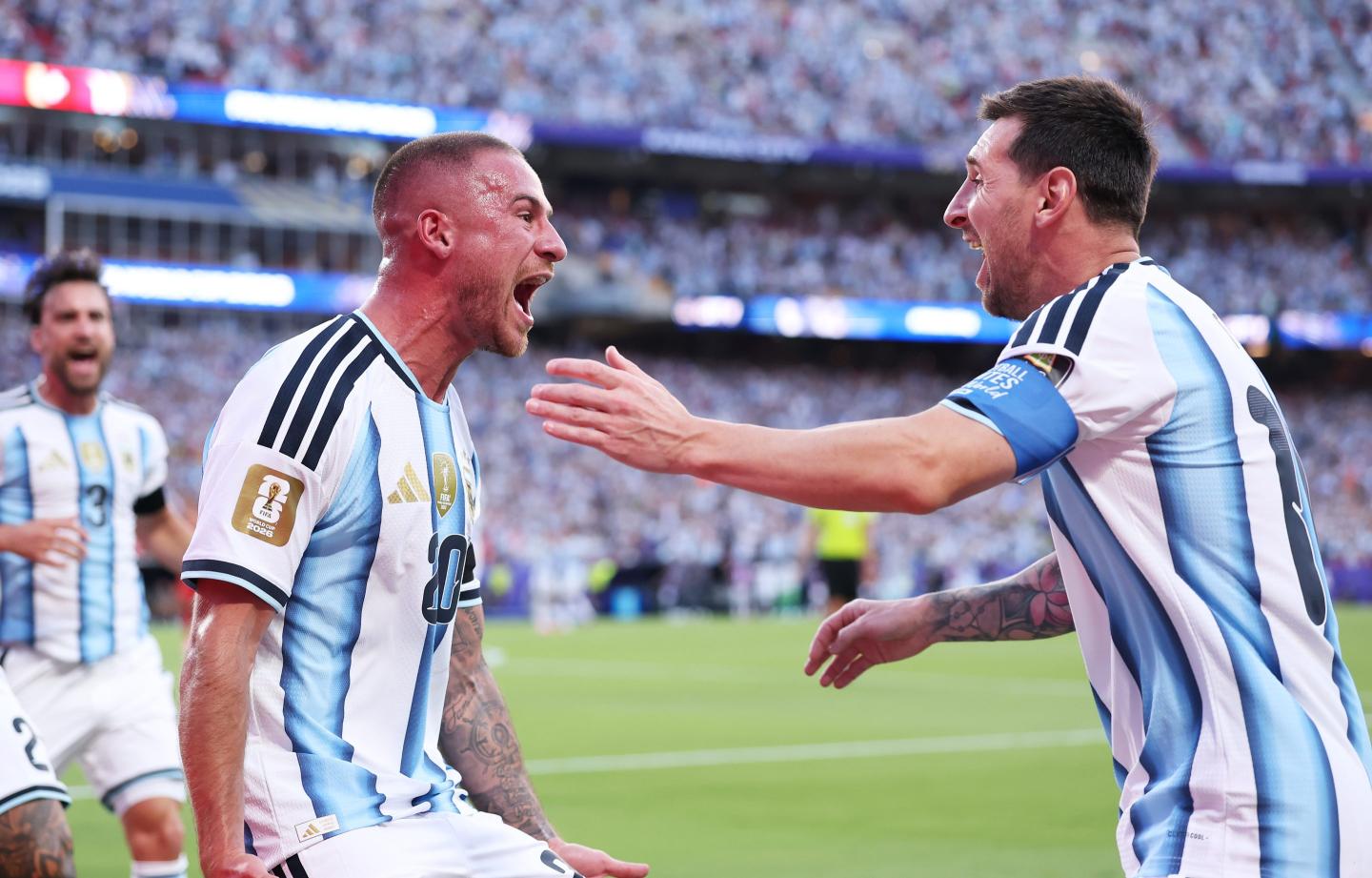 Alexis Mac Allister #20 of Argentina celebrates with Lionel Messi #10 after scoring the team's first goal during the FIFA World Cup 2026 Quarter Final match between Argentina and Switzerland at Kansas City Stadium on July 11, 2026 in Kansas City, Missouri.