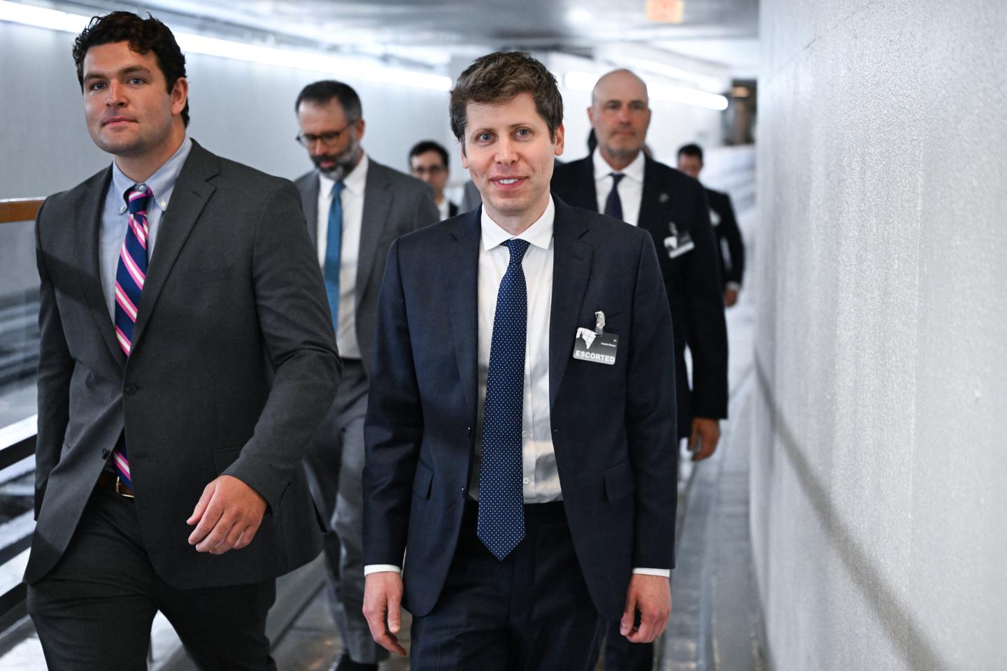 OpenAI CEO Sam Altman walking.