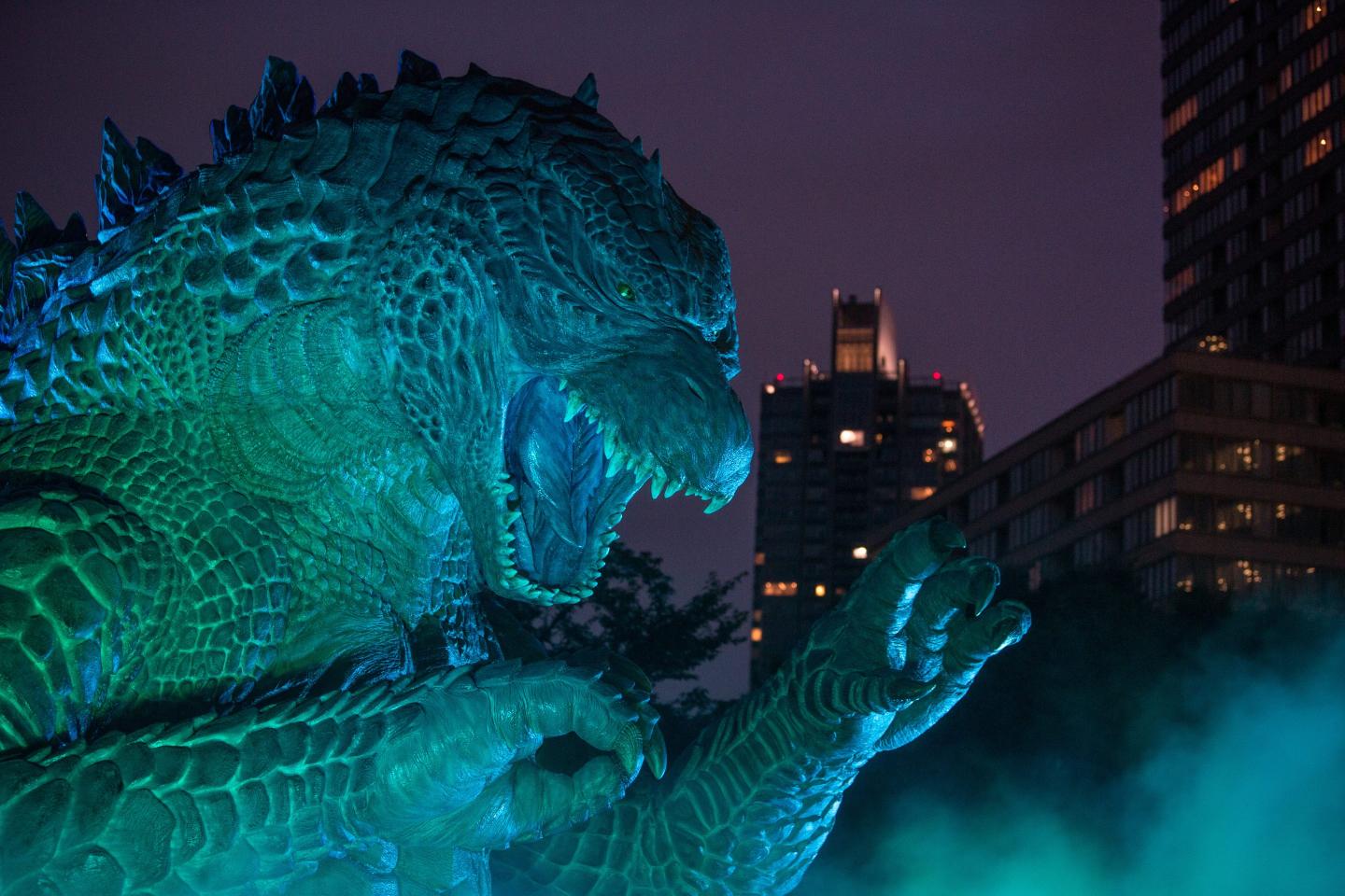 A replica Godzilla is lit up during a press preview at Tokyo Midtown on July 17, 2014 in Tokyo, Japan.