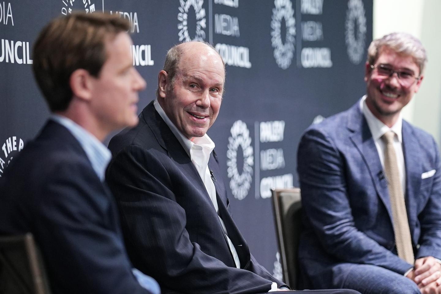 Michael Eisner sits alongside CEO and Founder of Delphi Interactive Casper Daugaard and OpenAI senior advisor Moritz Baier-Lentz at a panel.