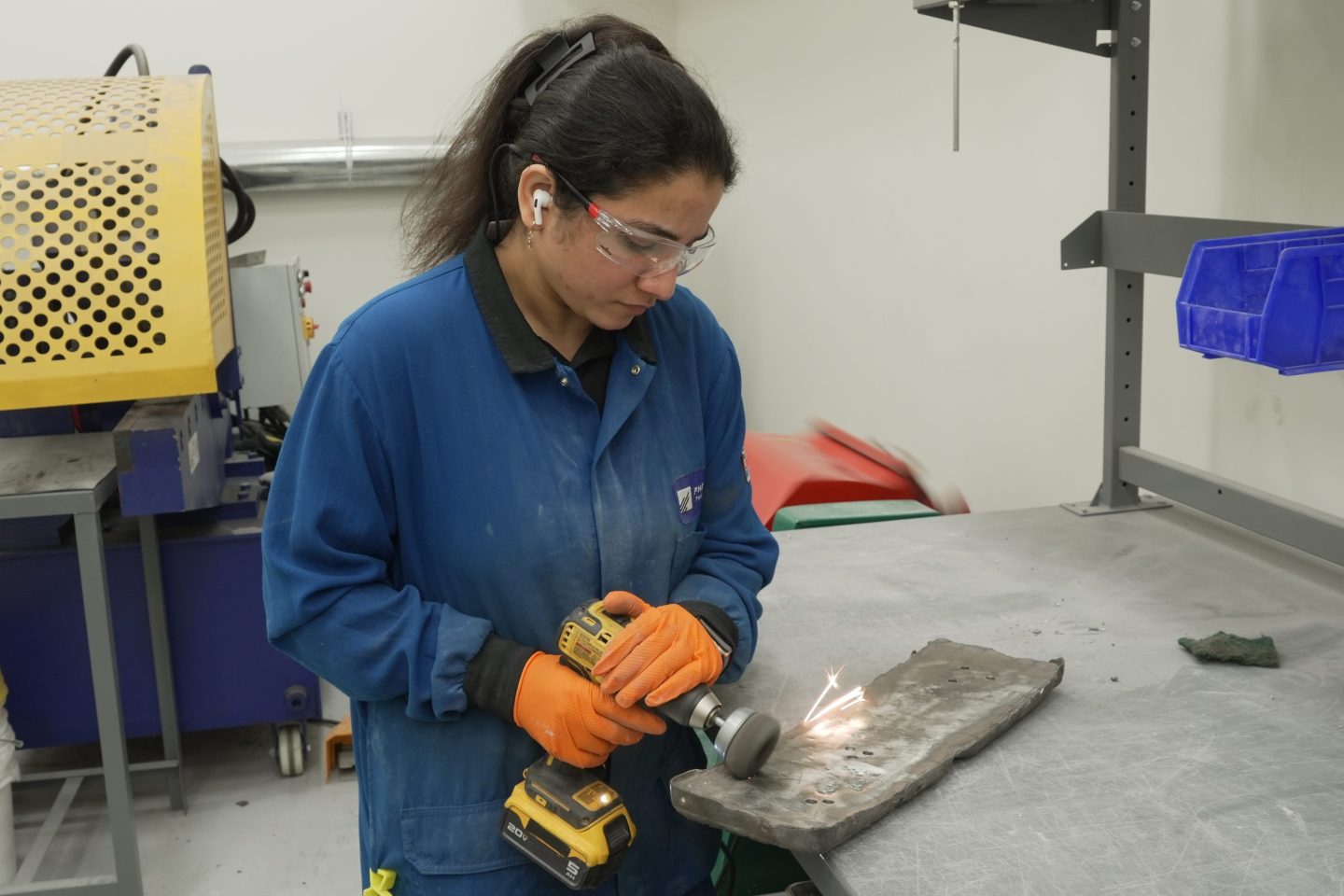 Photo of worker polishing rare earth metal ingot