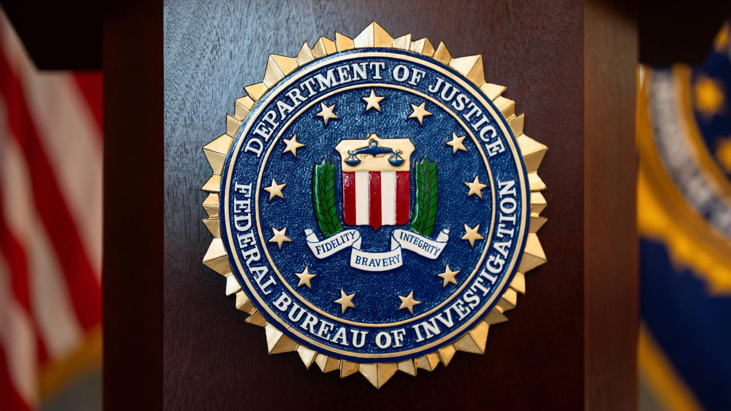 An FBI seal is displayed on a podium before a news conference at the field office in Portland, Ore., Jan. 16, 2025. 