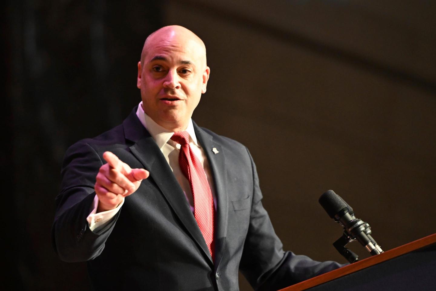 Dave Sunday gestures while speaking to the audience in the Forum Auditorium across the street from the Capitol after taking the oath of office to become Pennsylvania's next attorney general.