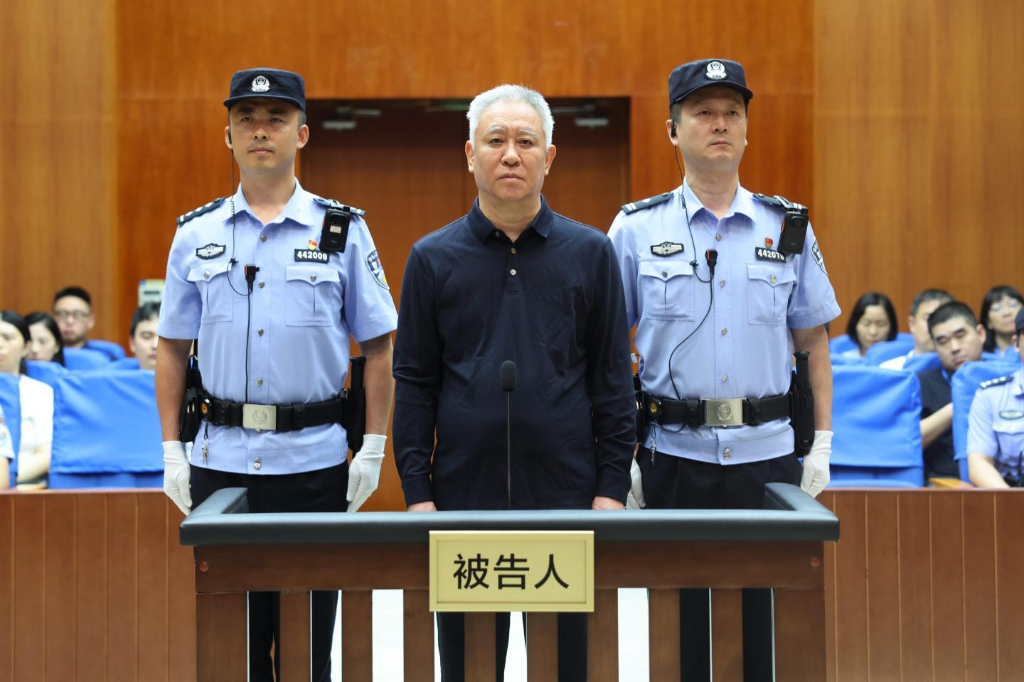 Photo of Evergrande's founder on trial
