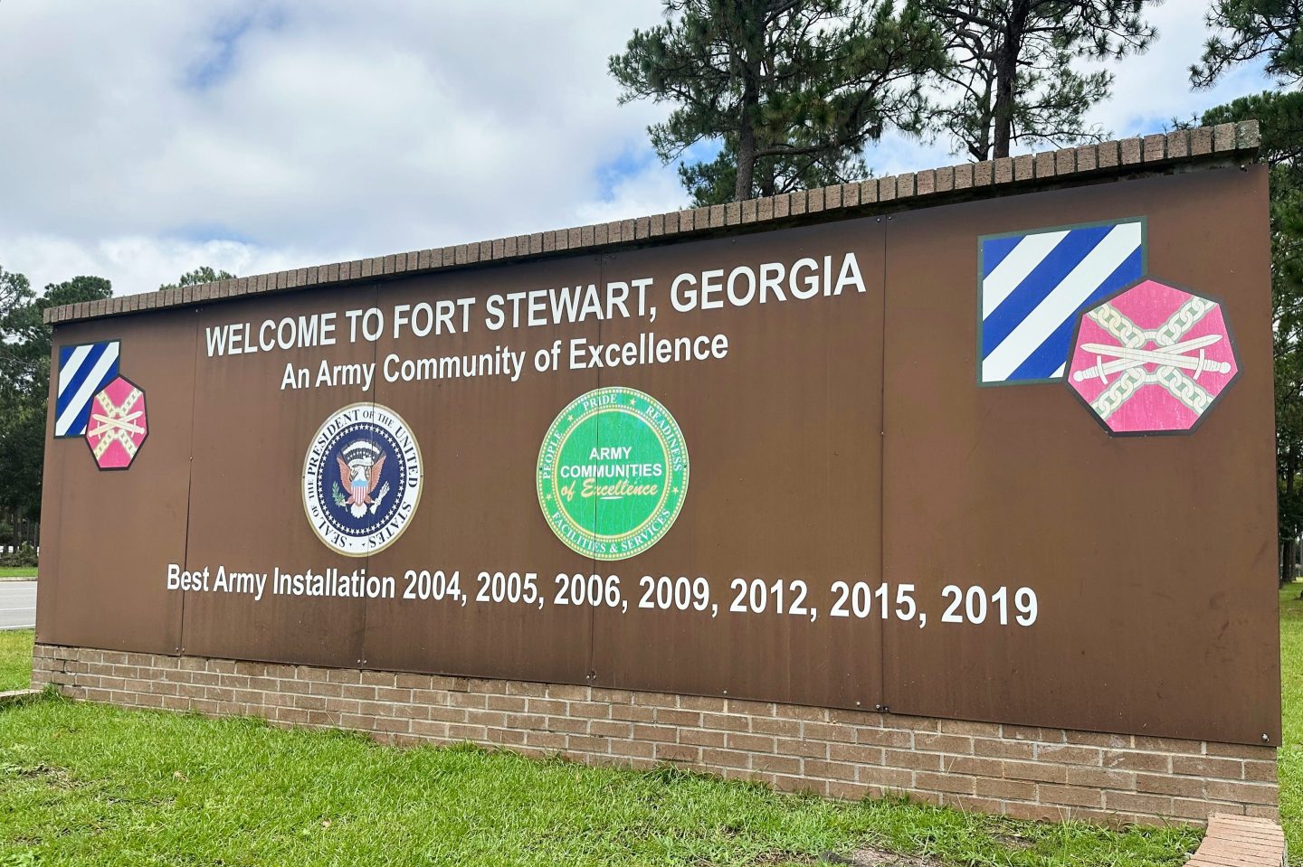A sign stands outside the main gate of Fort Stewart, Ga.