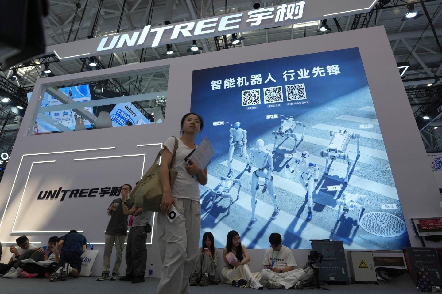 Photo of people at Unitree booth at a world robot conference