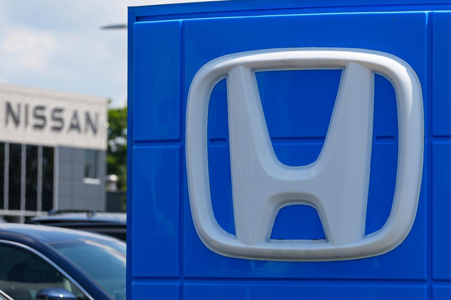 The Honda and Nissan dealerships are shown in Carmel, Ind.