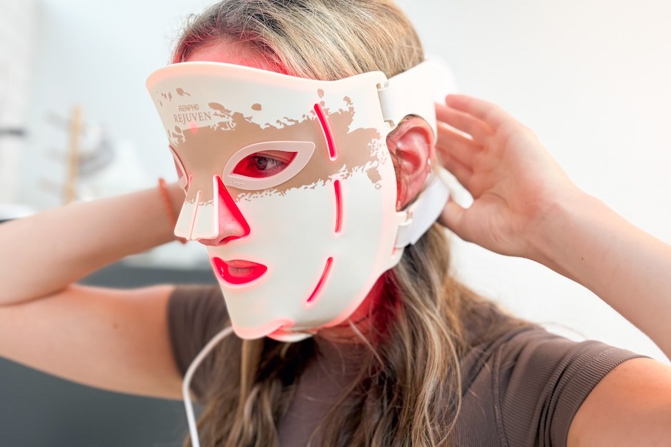 A woman wearing the RENPHO Rejuven Red Light Therapy Mask