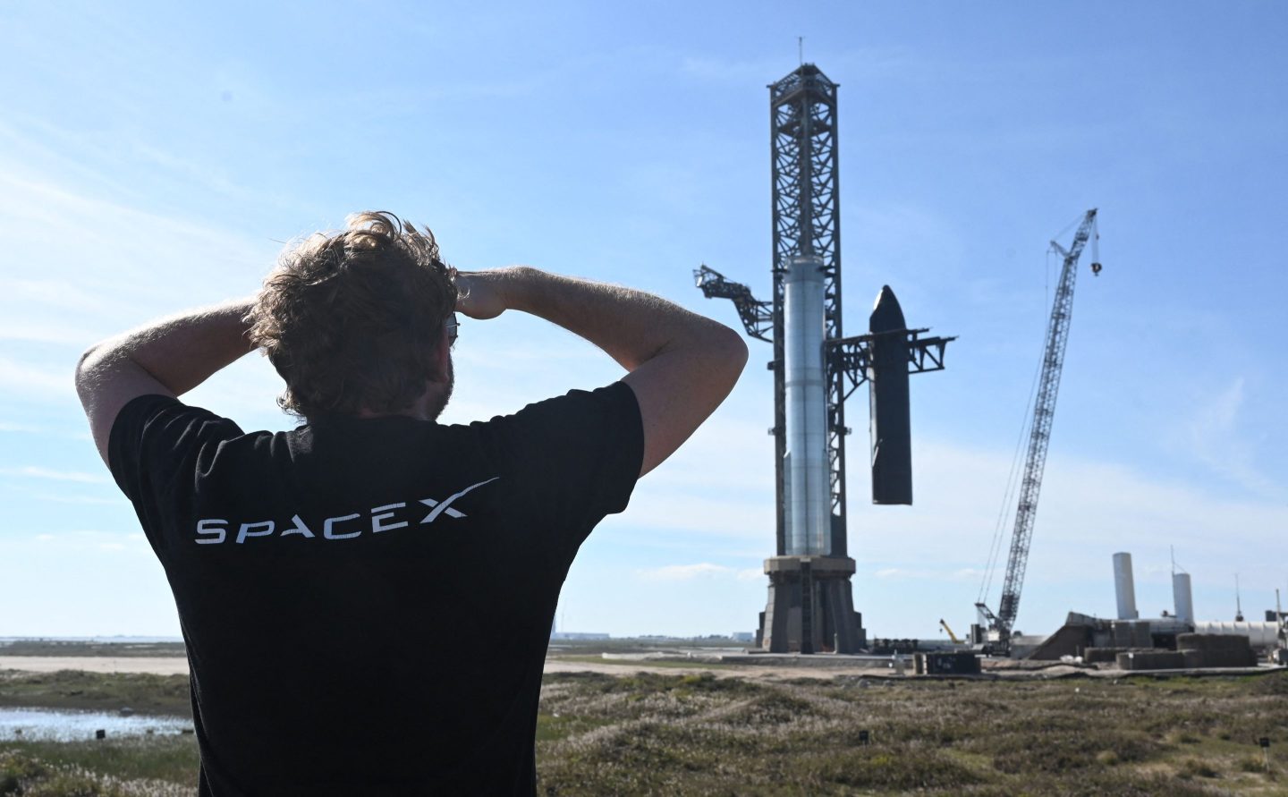 Man in t-shirt stares at rocket
