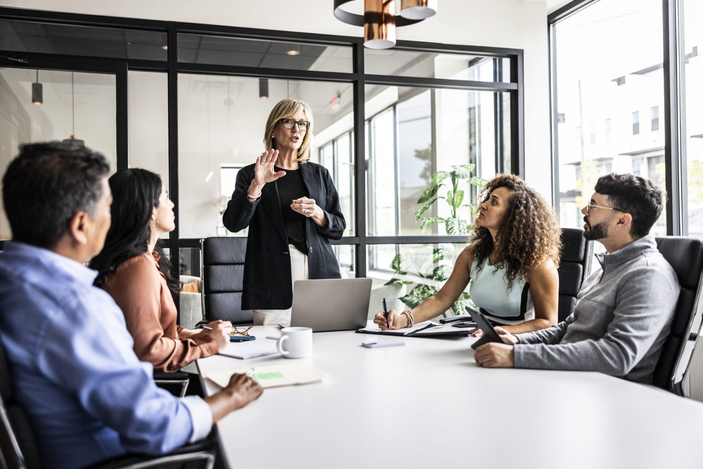 Colleagues gather together in an office.