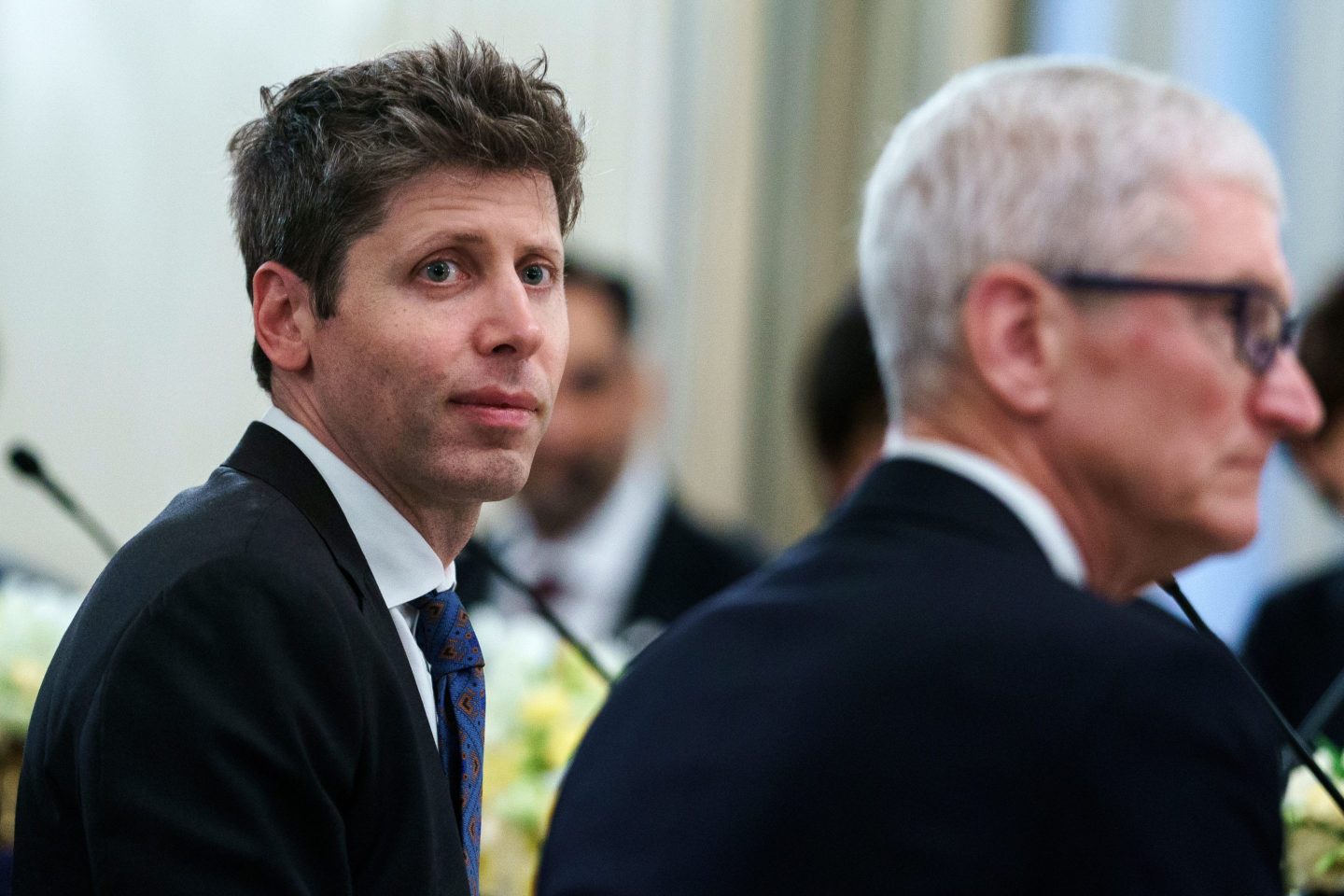 Sam Altman and Tim Cook.