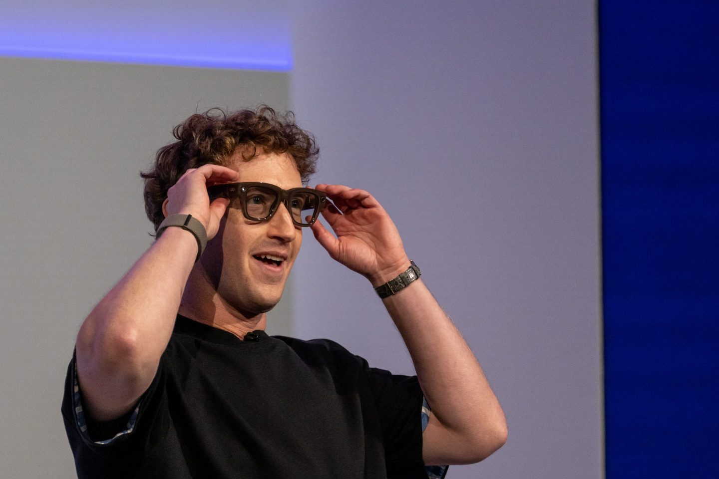Mark Zuckerberg, chief executive officer of Meta Platforms Inc., wears a pair of Meta Ray-Ban Display AI glasses during the Meta Connect event.