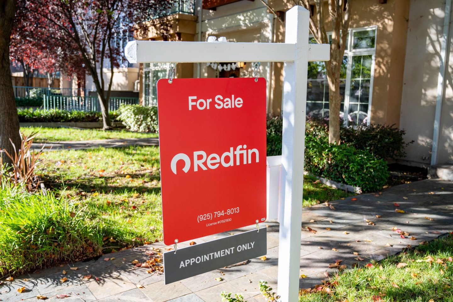 For Sale real estate sign for Redfin in front of a townhome, Walnut Creek, California.