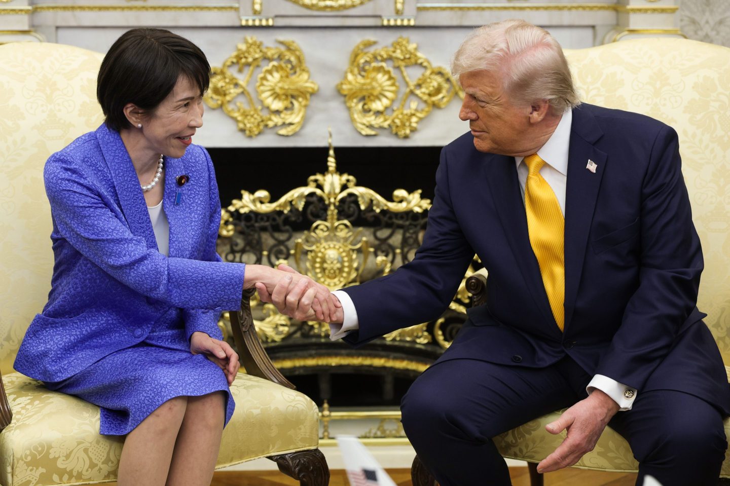 Photo of Trump and Takaichi shaking hands