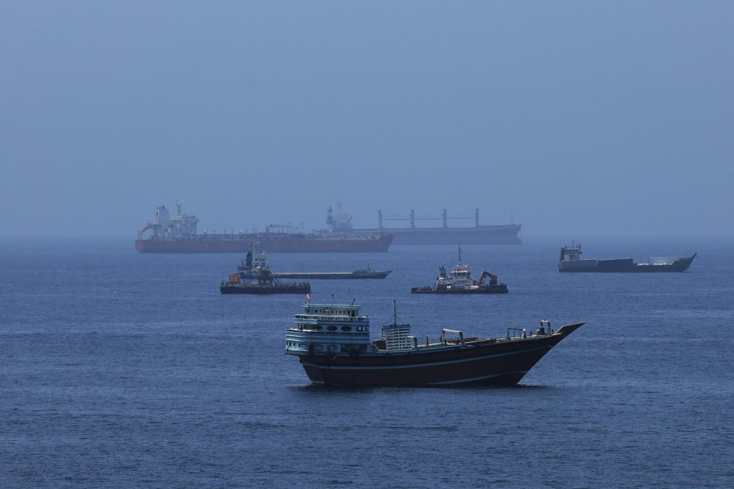 A view of commercial cargo vessels and crude oil tankers are anchored in the Gulf of Oman, off the coast of Muscat, Oman