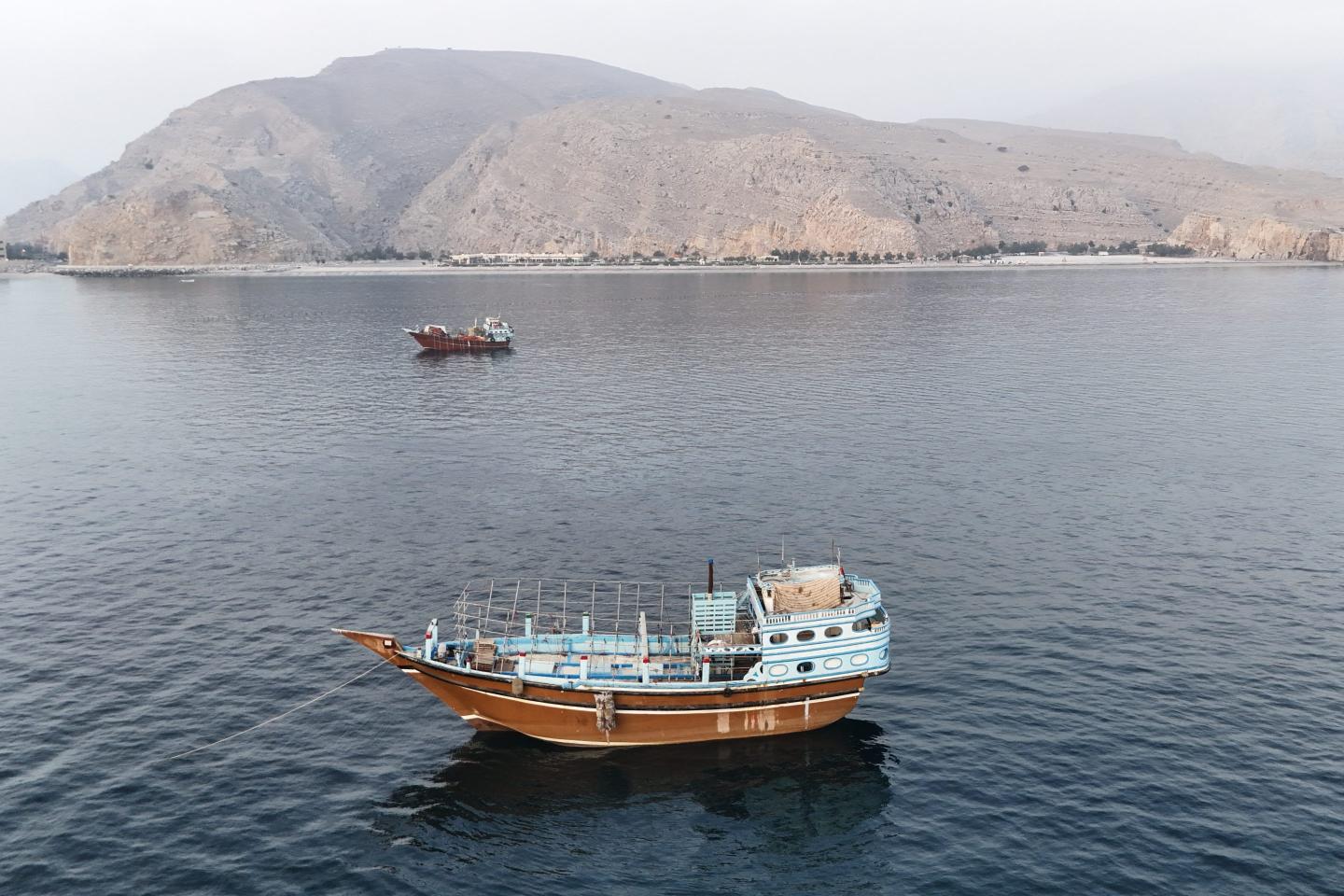 This aerial photograph shows boats anchored off Oman's northern Musandam Peninsula near the Strait of Hormuz on June 27, 2026.