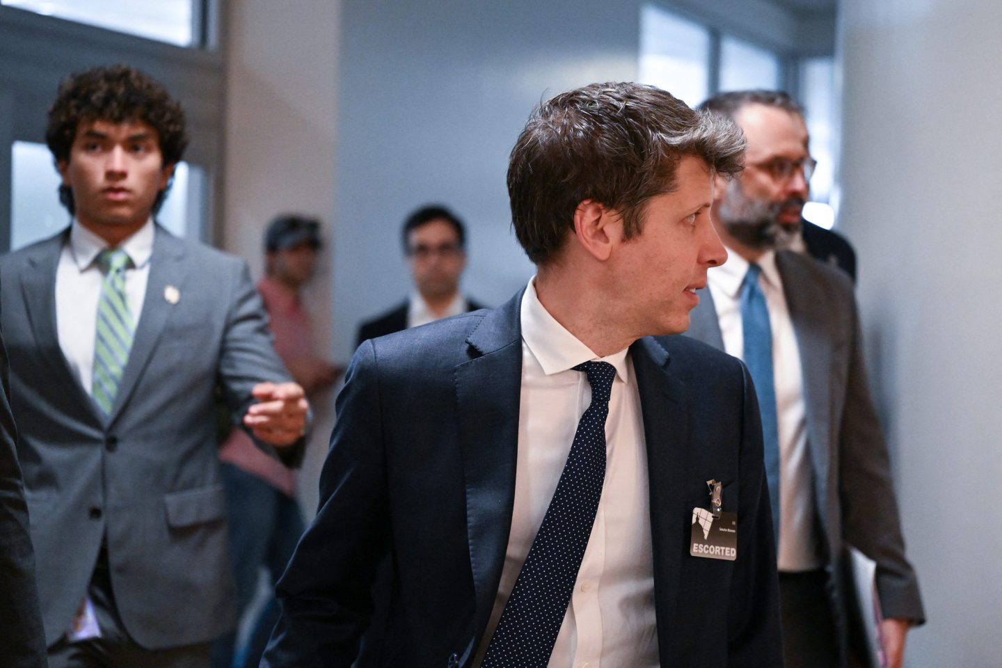 Sam Altman walking.