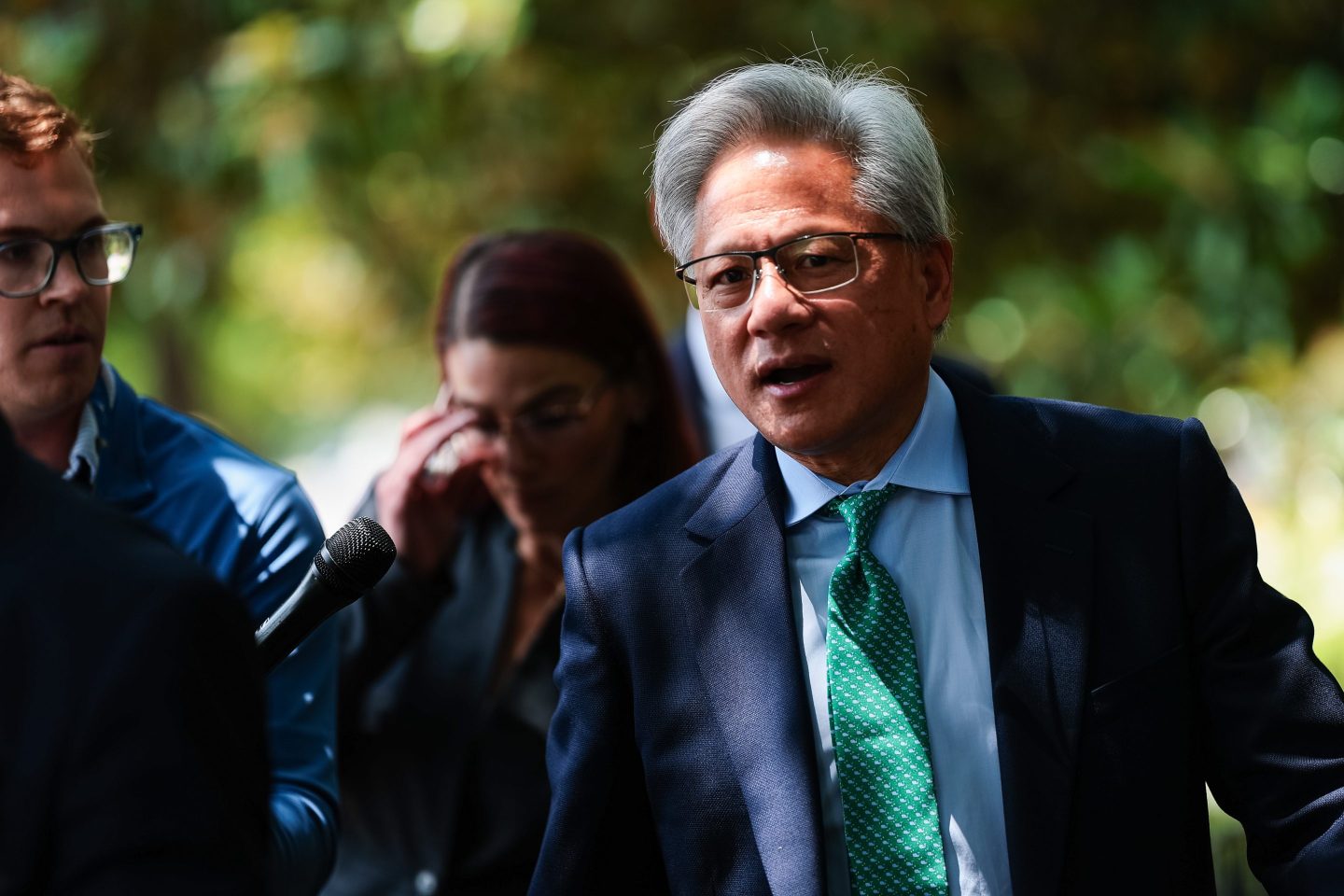 Nvidia CEO Jensen Huang talks to members of the press as he leaves the Hart Senate Office Building on July 28, 2026 in Washington, DC.