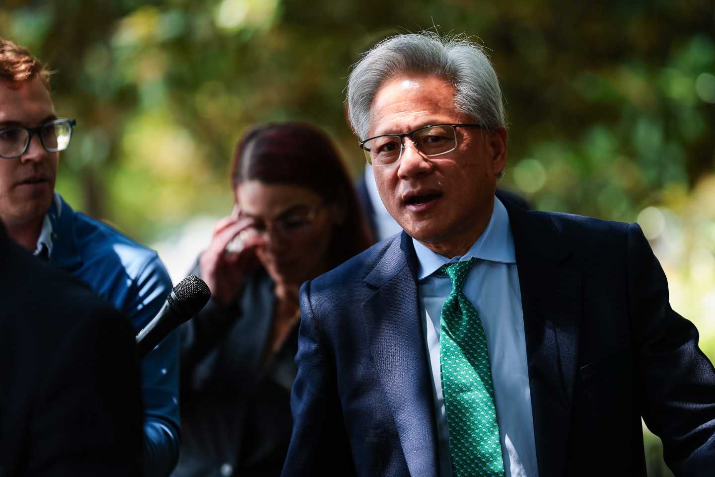 Nvidia CEO Jensen Huang talks to members of the press as he leaves the Hart Senate Office Building on July 28, 2026 in Washington, DC.