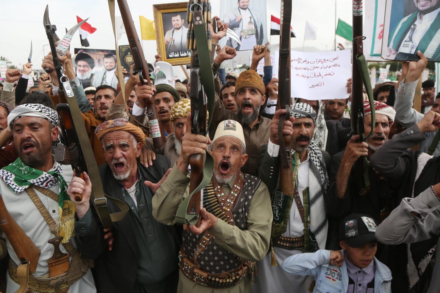 Yemeni protesters brandish weapons and shout slogans during a protest staged against the continued Saudi-led blockade on Yemen on July 31, 2026 in Sana'a, Yemen.