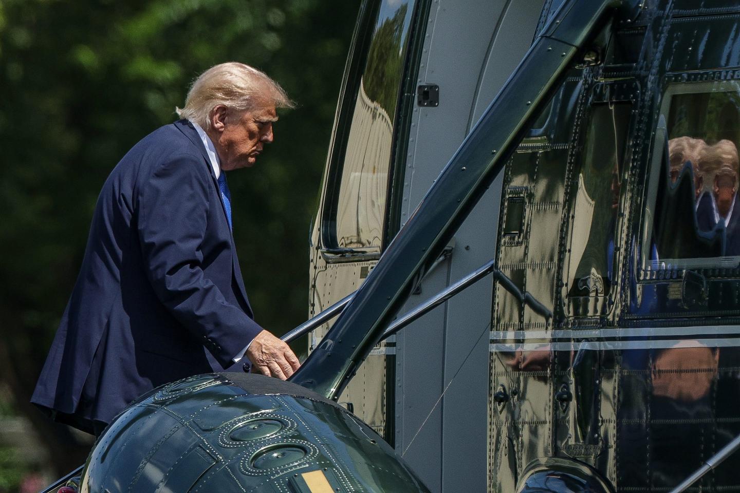 President Donald Trump boards Marine One en route to Joint Base Andrews from the Ellipse near the White House on August 4, 2026.