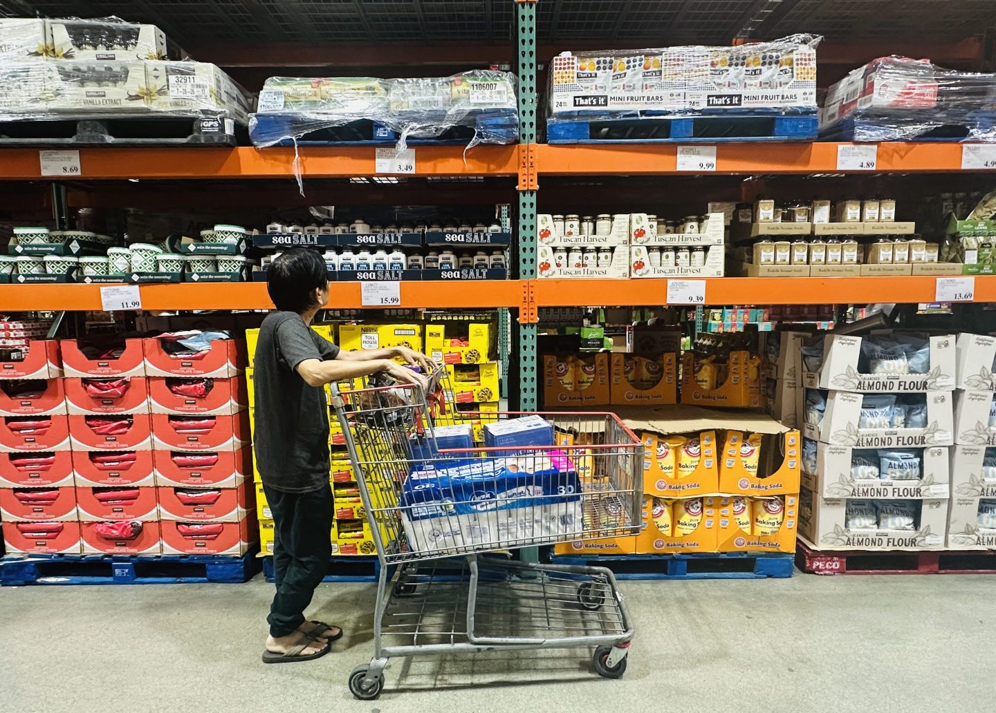 A shopper browses an aisle of food items from a wholesale retailer in Alhambra, California on August 11, 2026