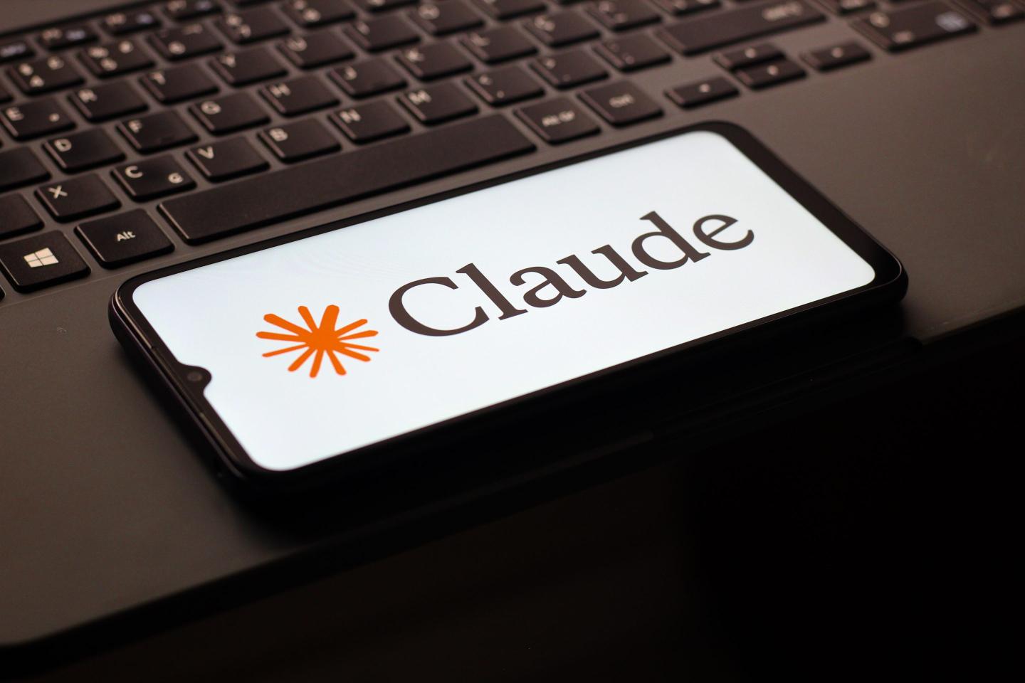 In this photo illustration, the Claude AI logo is seen displayed on a smartphone screen.