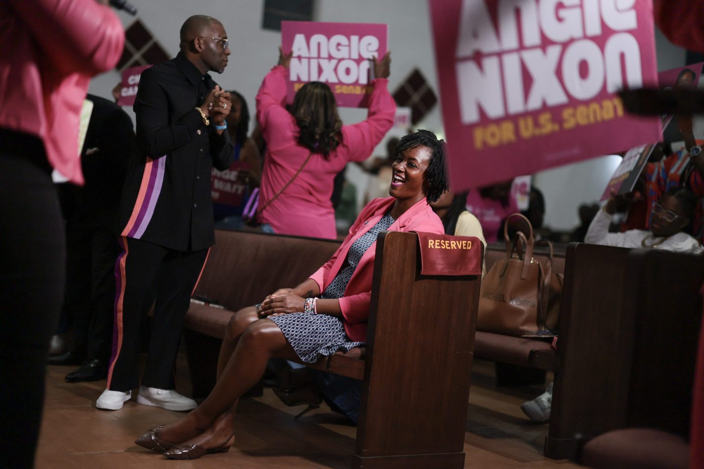 Democratic U.S. Senate candidate, Florida state Rep. Angie Nixon participates in a worship service during a visit to the Ebenezer Missionary Baptist Church.