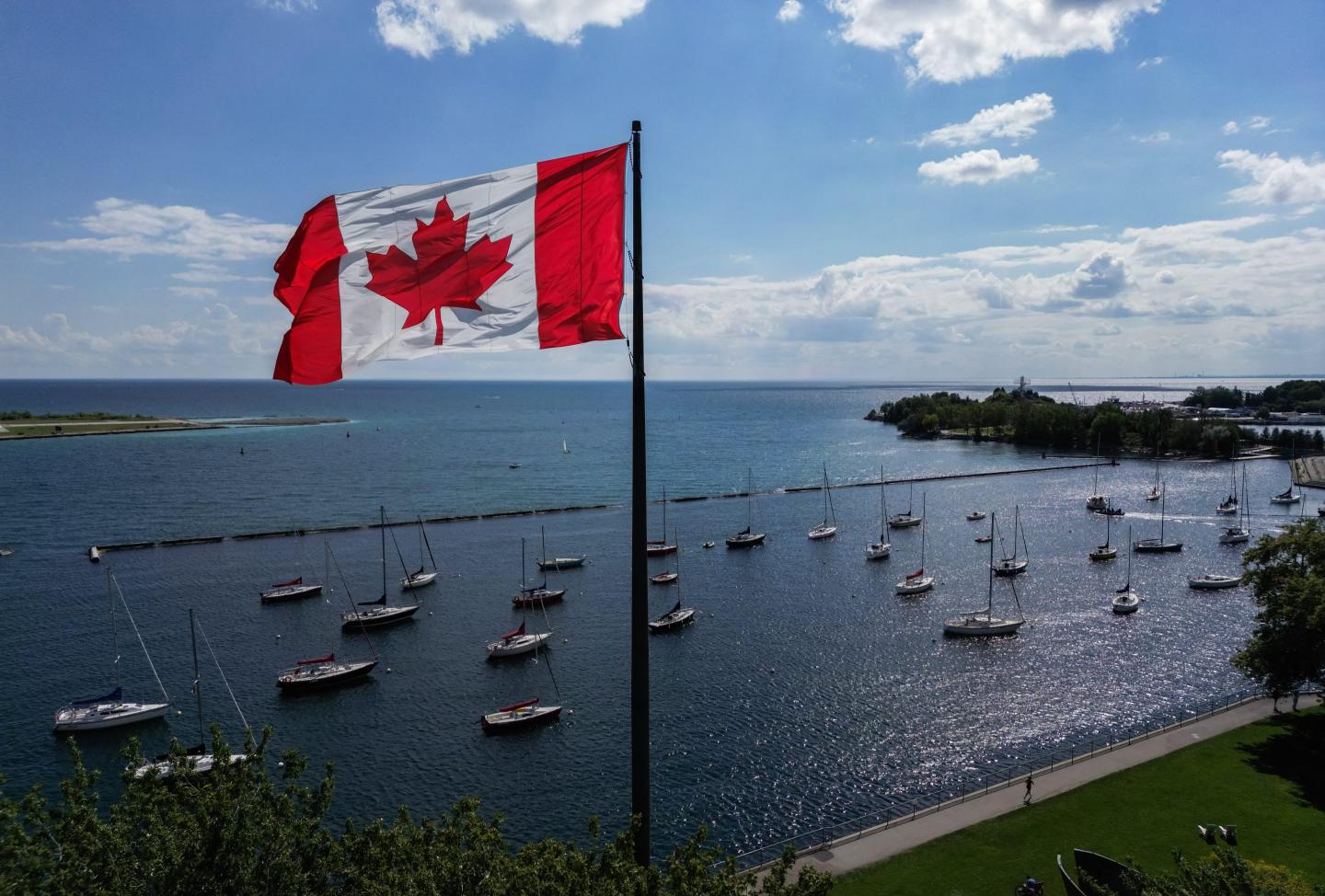 A Canadian flag flies along the waterfront of Lake Ontario, in Toronto, Ontario, Canada, on August 27, 2026. 