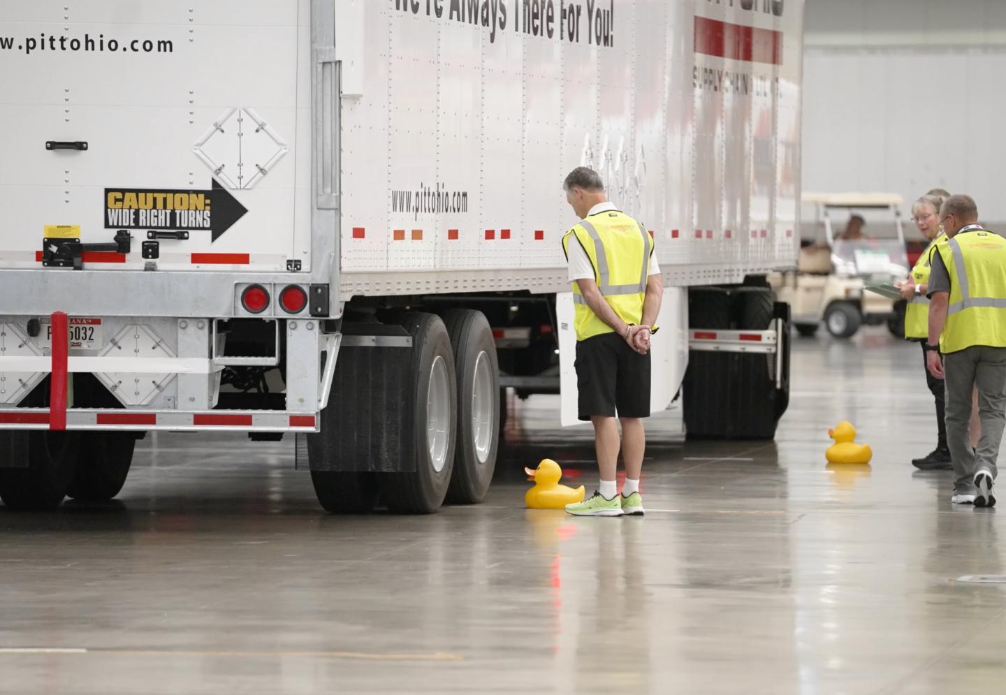 A truck drives past a rubber duck during the obstacle course.