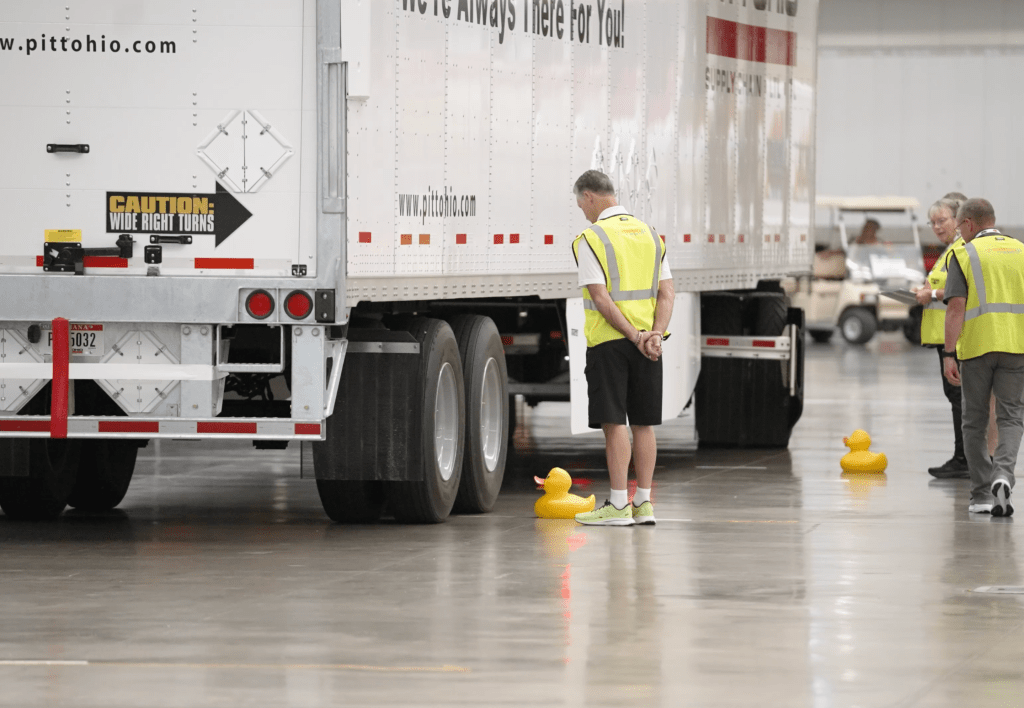 A truck drives past a rubber duck during the obstacle course.