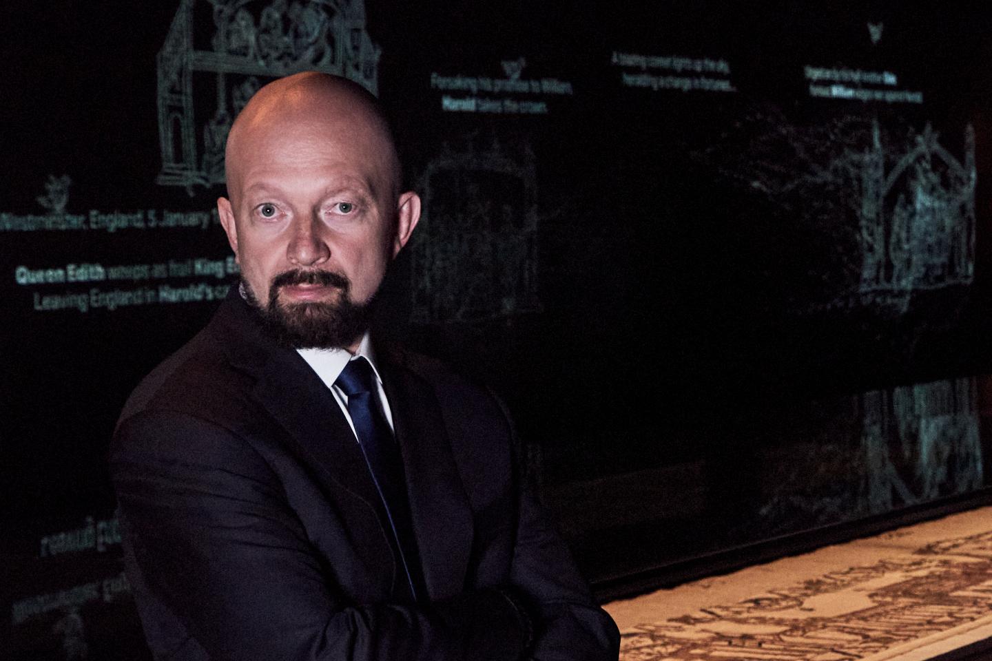 Igor Tulchinsky stands in front of the Bayeux Tapestry exhibition in London. It is the first time the tapestry has been seen in the U.K.