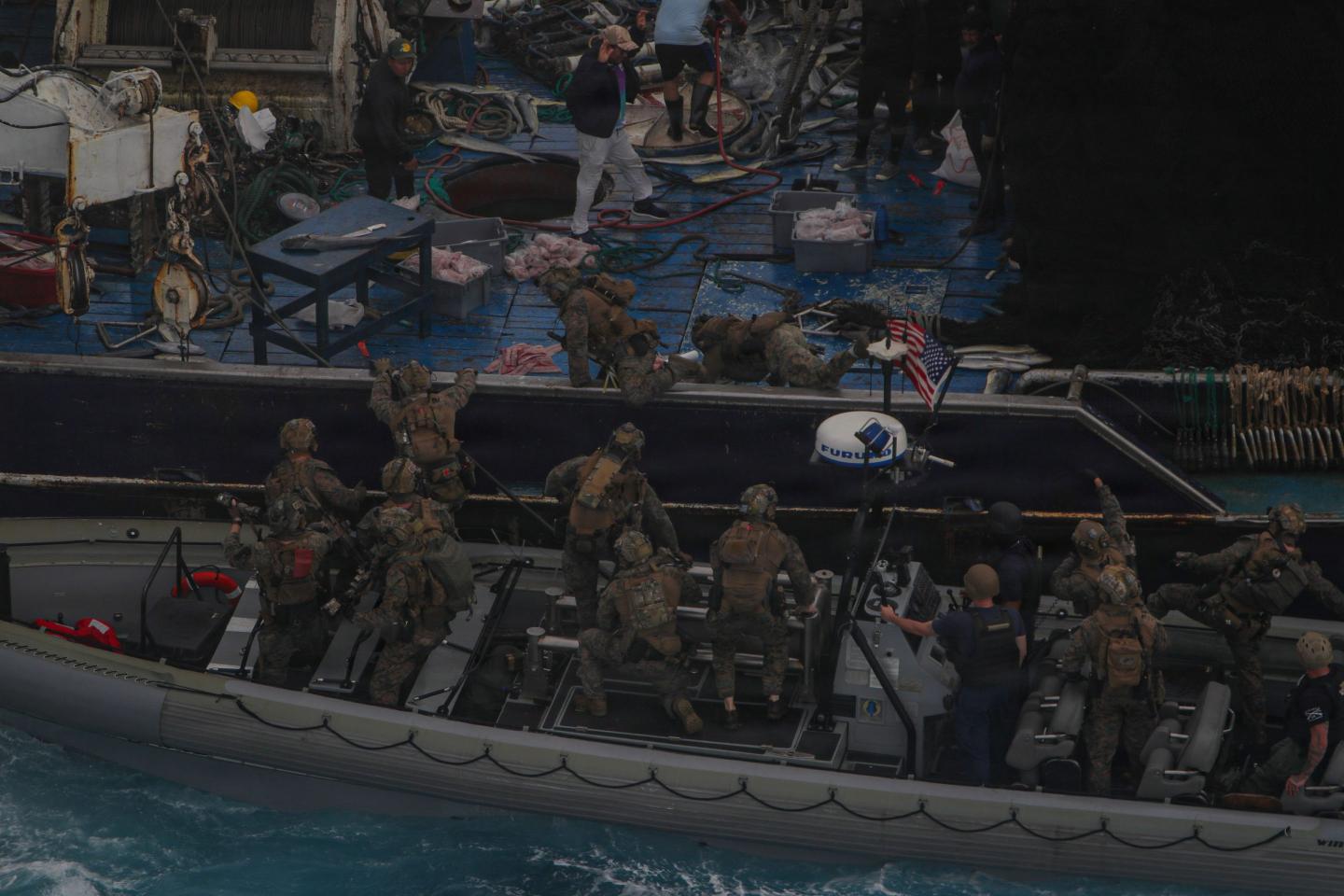 U.S. Marines with Maritime Raid Force, Littoral Combat Force-24, board a vessel from a rigid-hull inflatable boat during a Maritime Interdiction Operation while in the Pacific Ocean, Sept. 7, 2026. 