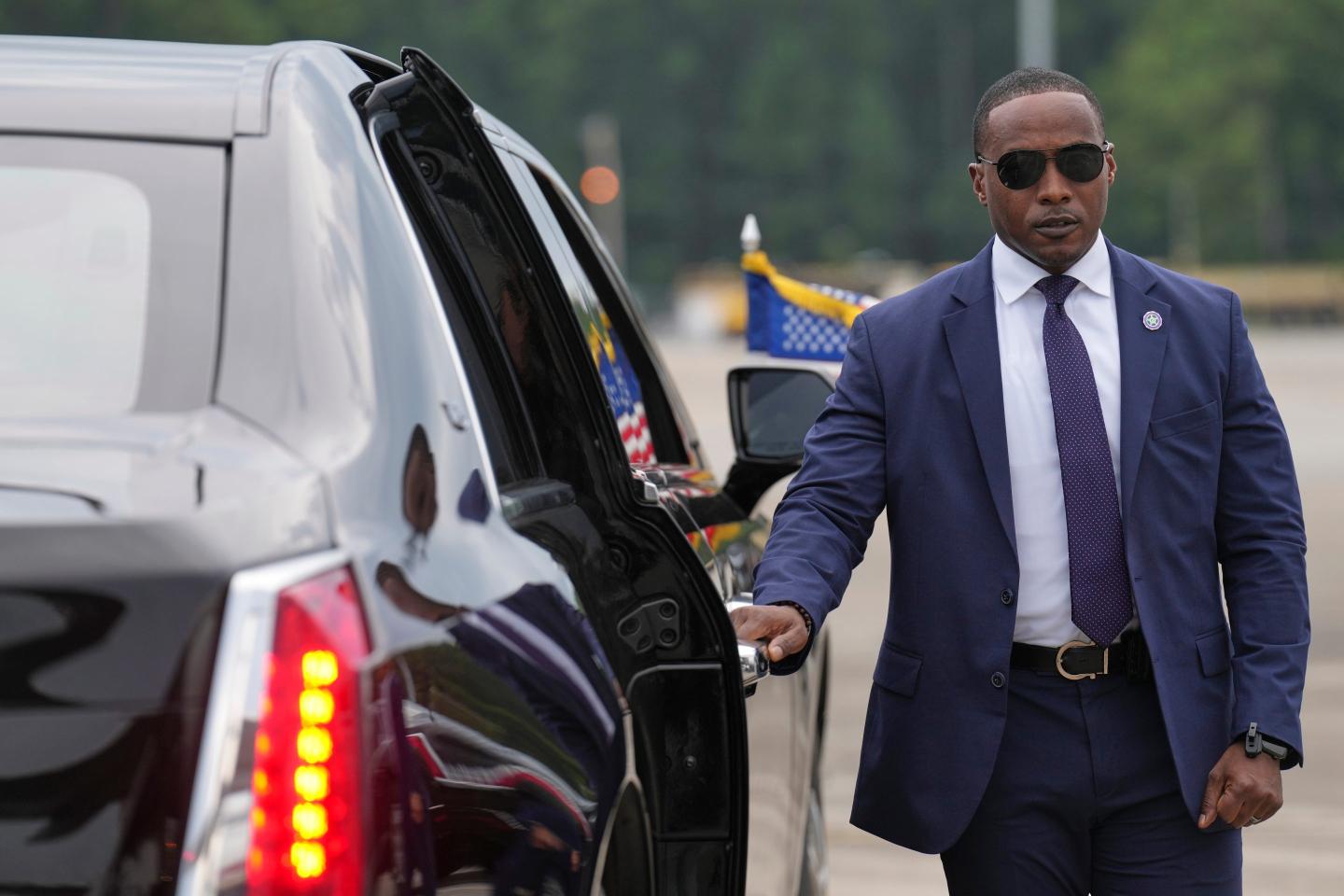 A member of the U.S. Secret Service stands before President Donald Trump arrives to board his limousine at Myrtle Beach International Airport.