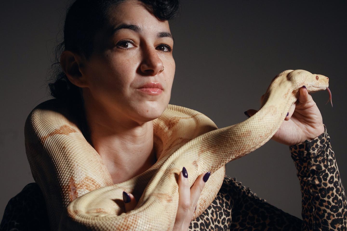 Performance artist Zoe Ziegfeld who plays the part of a snake charmer poses for a portrait with a snake during auditions to select a snake for a part in an adaptation of Mozart’s “Così fan tutte," at the Metropolitan Opera in New York, Friday, Aug. 28, 2026.