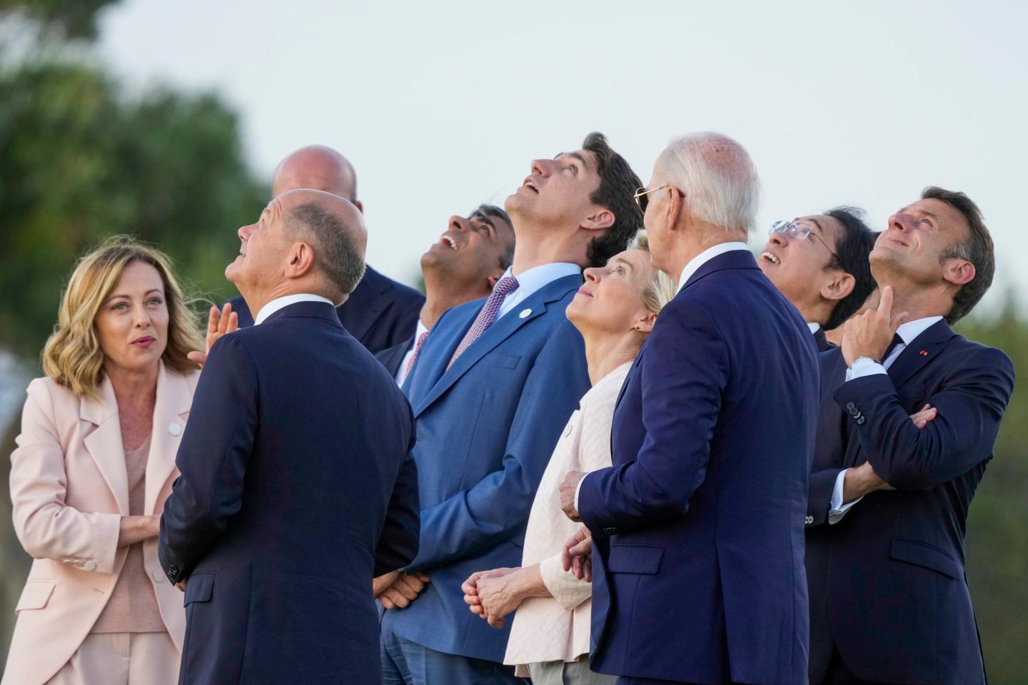 From right, French President Emmanuel Macron, Japan's Prime Minister Fumio Kishida, U.S. President Joe Biden, European Commission President Ursula von der Leyen, Canada's Prime Minister Justin Trudeau, Britain's Prime Minister Rishi Sunak, European Council President Charles Michel, German Chancellor Olaf Scholz and Italian Prime Minister Giorgia Meloni watch a skydiving demo during the G7 world leaders summit at Borgo Egnazia, Italy.