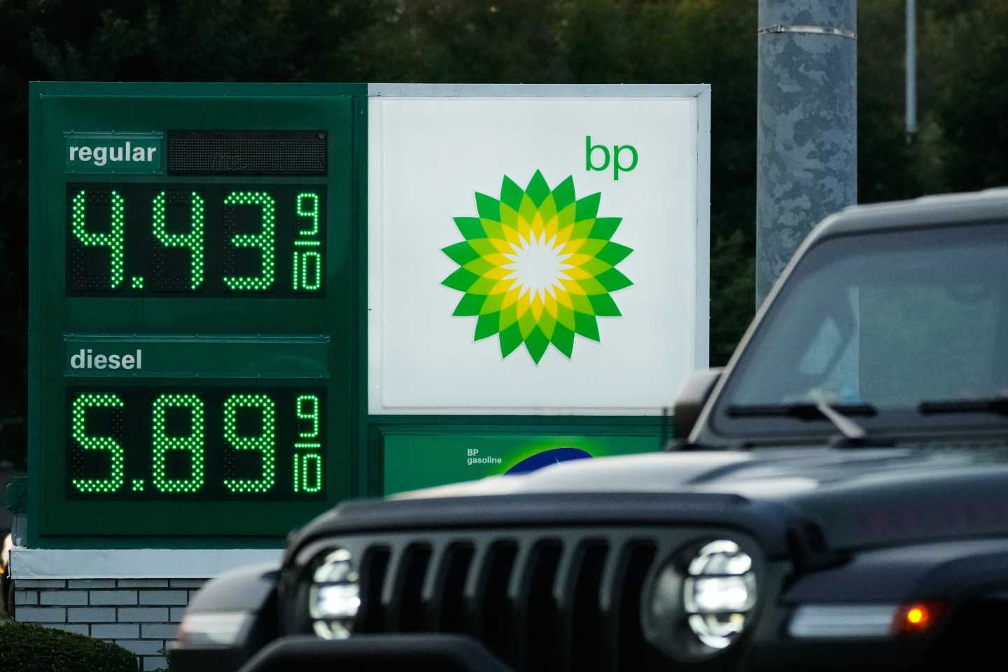 Photo of Diesel cost next to a car