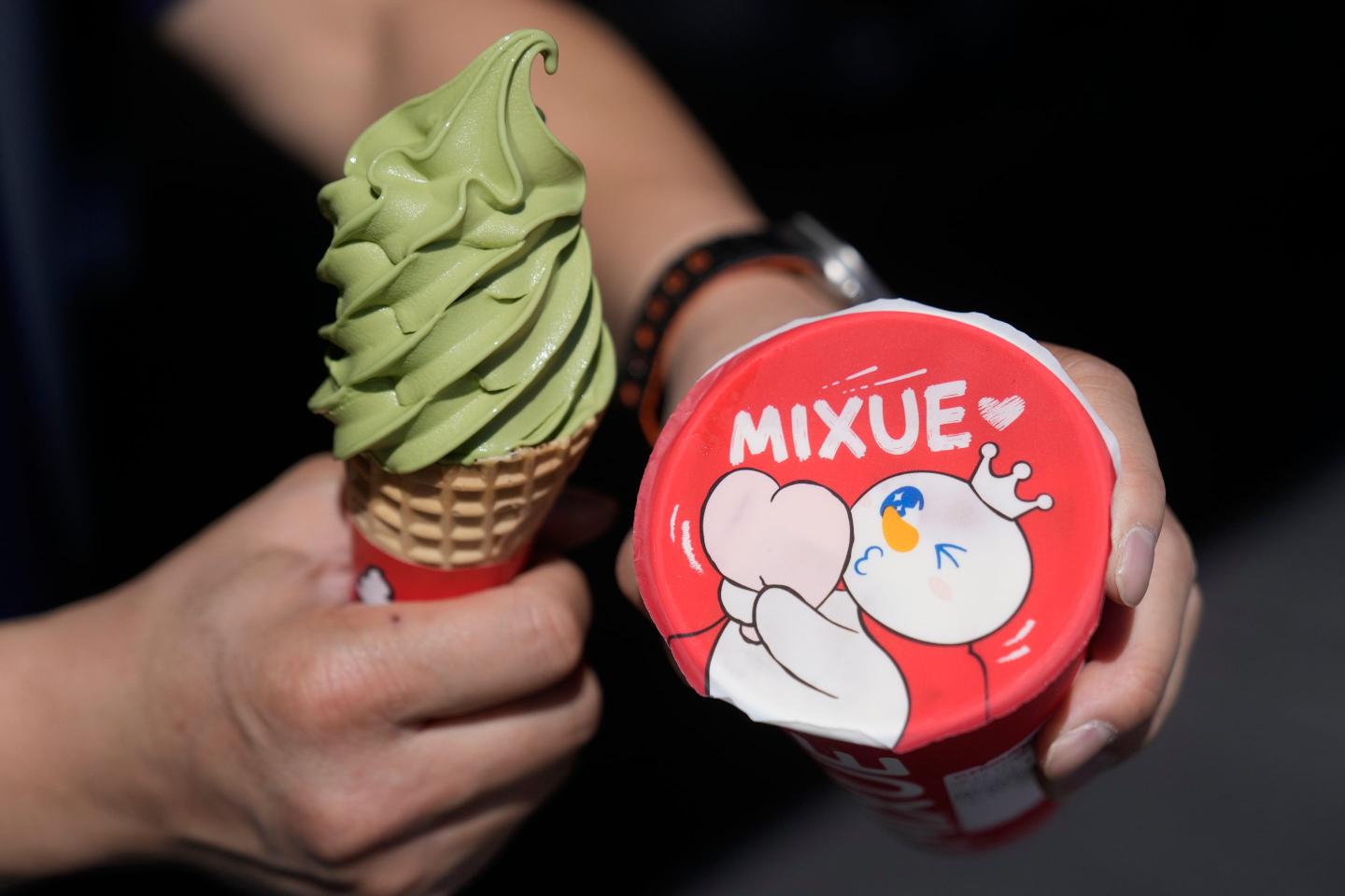 A customer holds an ice cream cone outside of a Mixue store, Wednesday, Sept. 16, 2026, in Sunnyvale, Calif. (