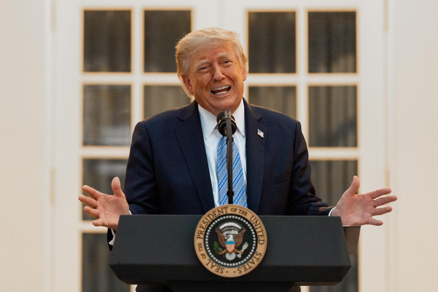 President Donald Trump speaks during a dinner in the Rose Garden of the White House.