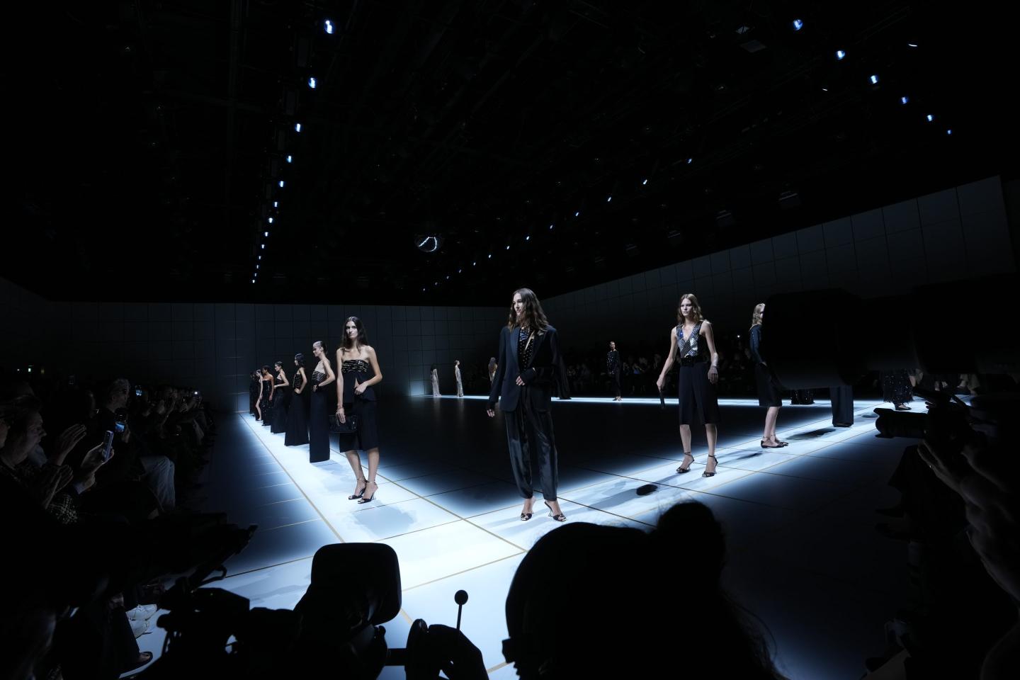 Models wear creations part of the Giorgio Armani women's Spring-Summer 2027 collection, presented in Milan, Italy, Sunday, Sept. 27, 2026.