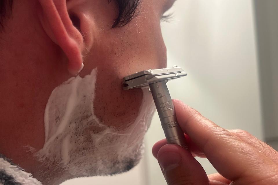 Our tester trying the best men's razors