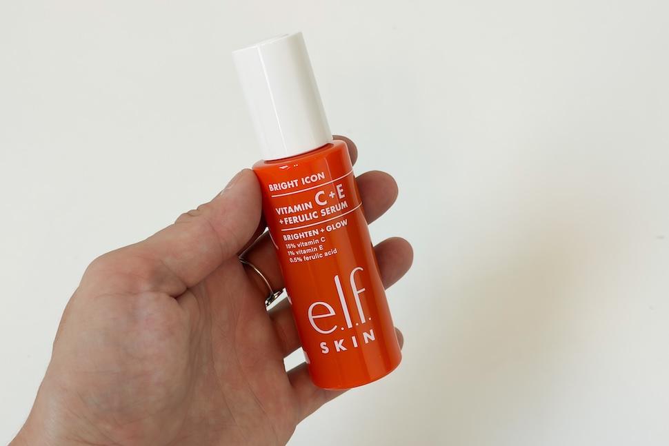 Closeup of a hand holding a bottle of e.l.f. Skin Bright Icon Vitamin C + E + Ferulic Serum