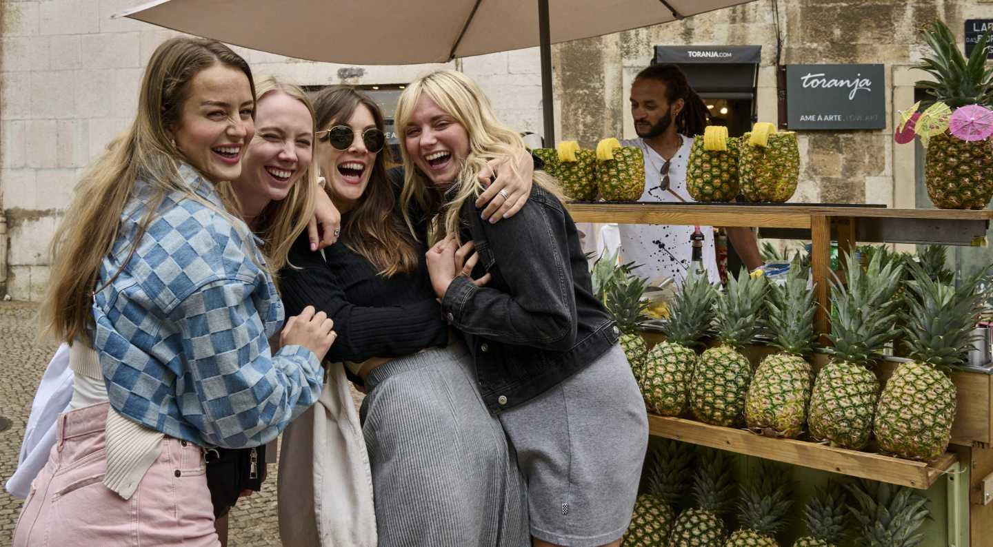The bank account says no while the Europe group chat says YOLO. Gen Z is cutting spending—but not on little treats and last-minute trips