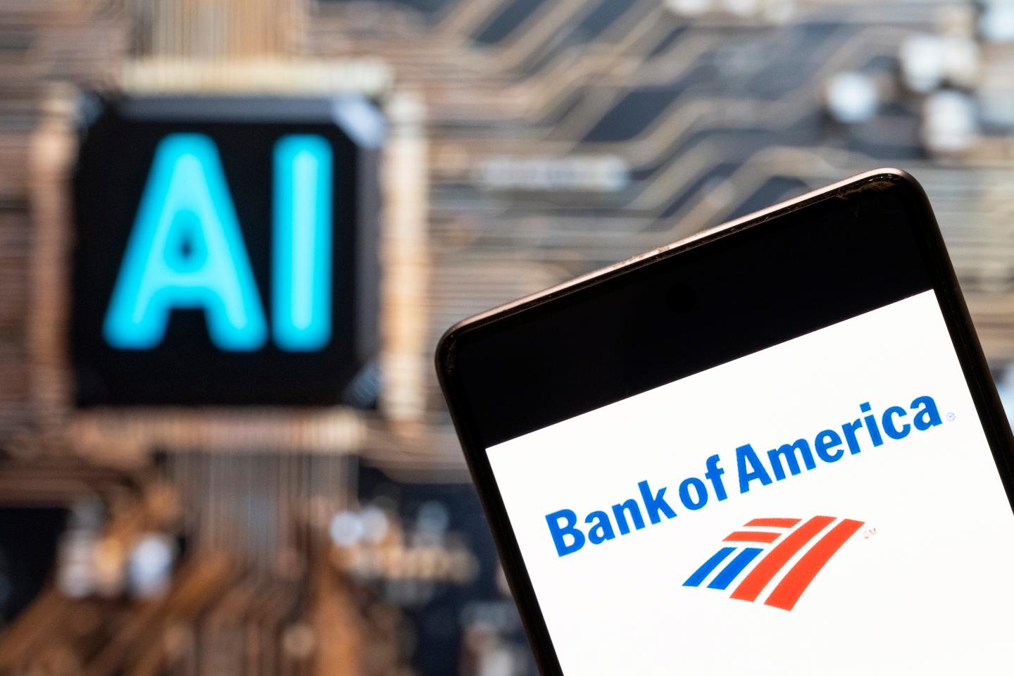 The Bank of America logo seen displayed on a smartphone with an Artificial intelligence (AI) chip and symbol in the background.
