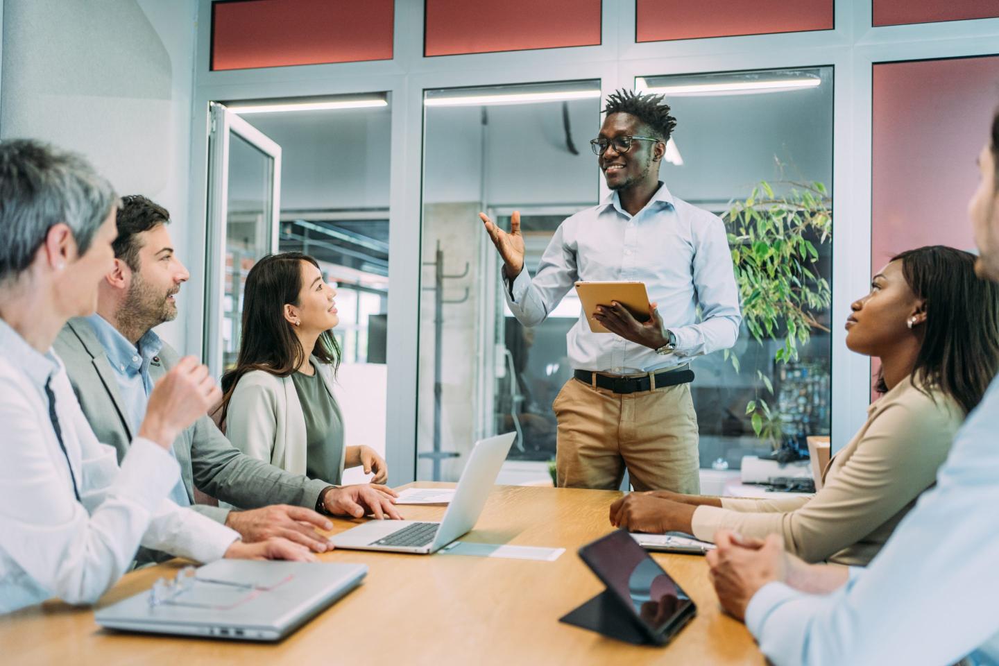 Young business person at the front of a conference table