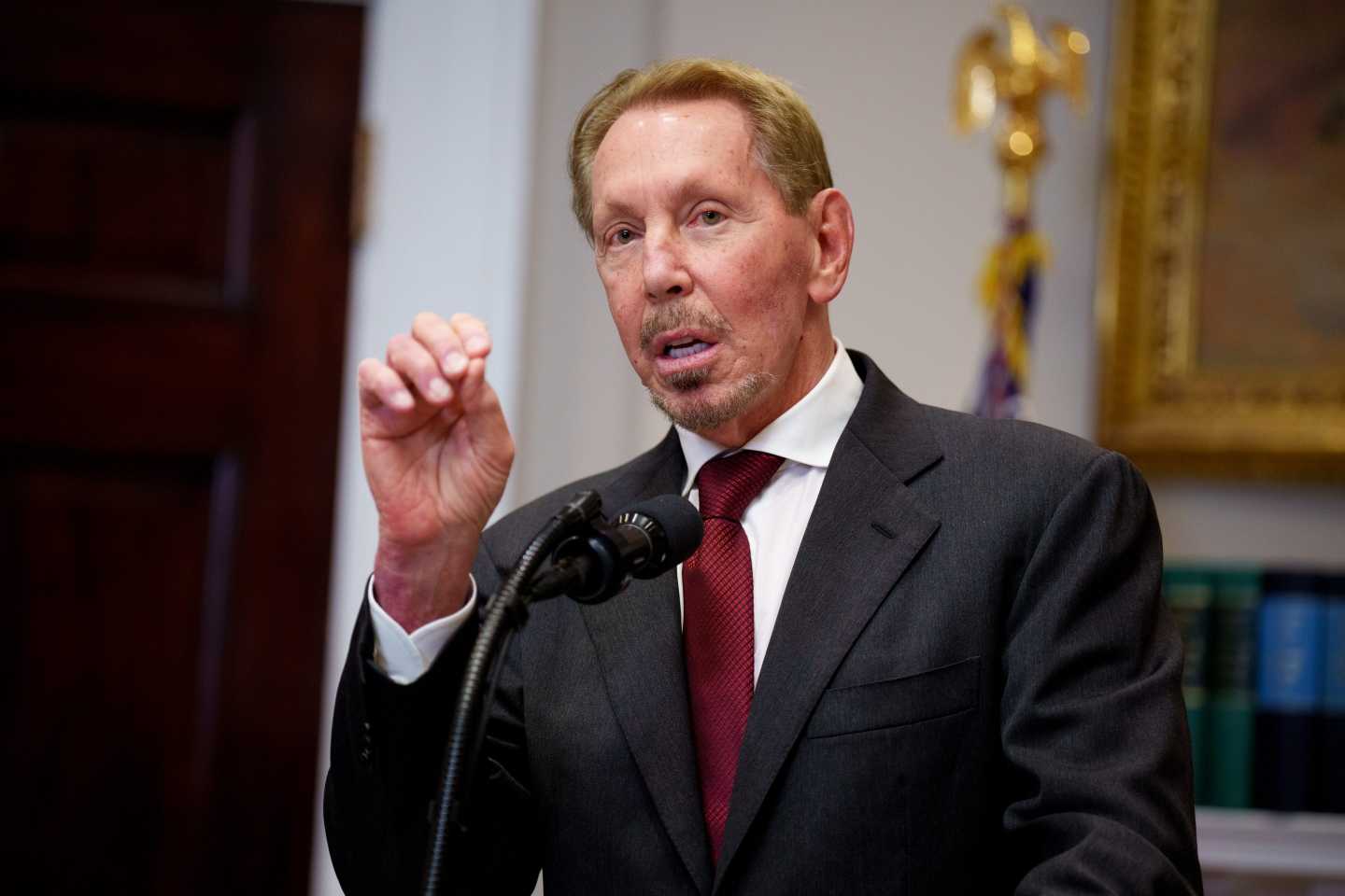 Man at a podium in a suit
