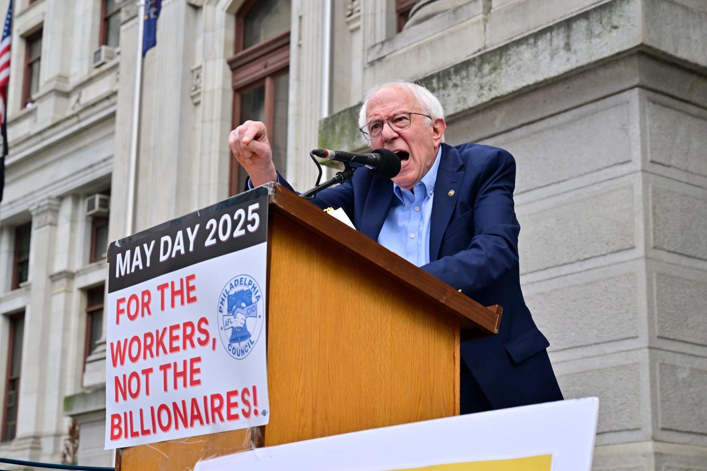 Sen. Bernie Sanders speaks at a 2025 workers’ rally. The longtime labor advocate is again pushing for a 32-hour workweek as AI boosts productivity.