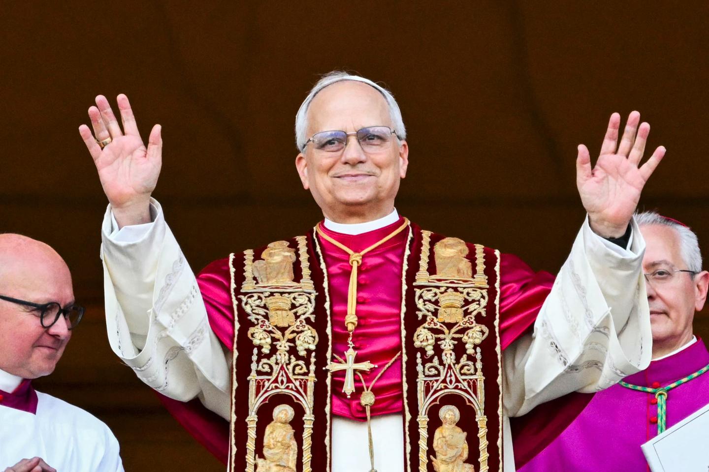 Newly elected Pope Leo XIV, Robert Prevost arrives on the main central loggia balcony of the St Peter's Basilica for the first time, after the cardinals ended the conclave, in The Vatican.