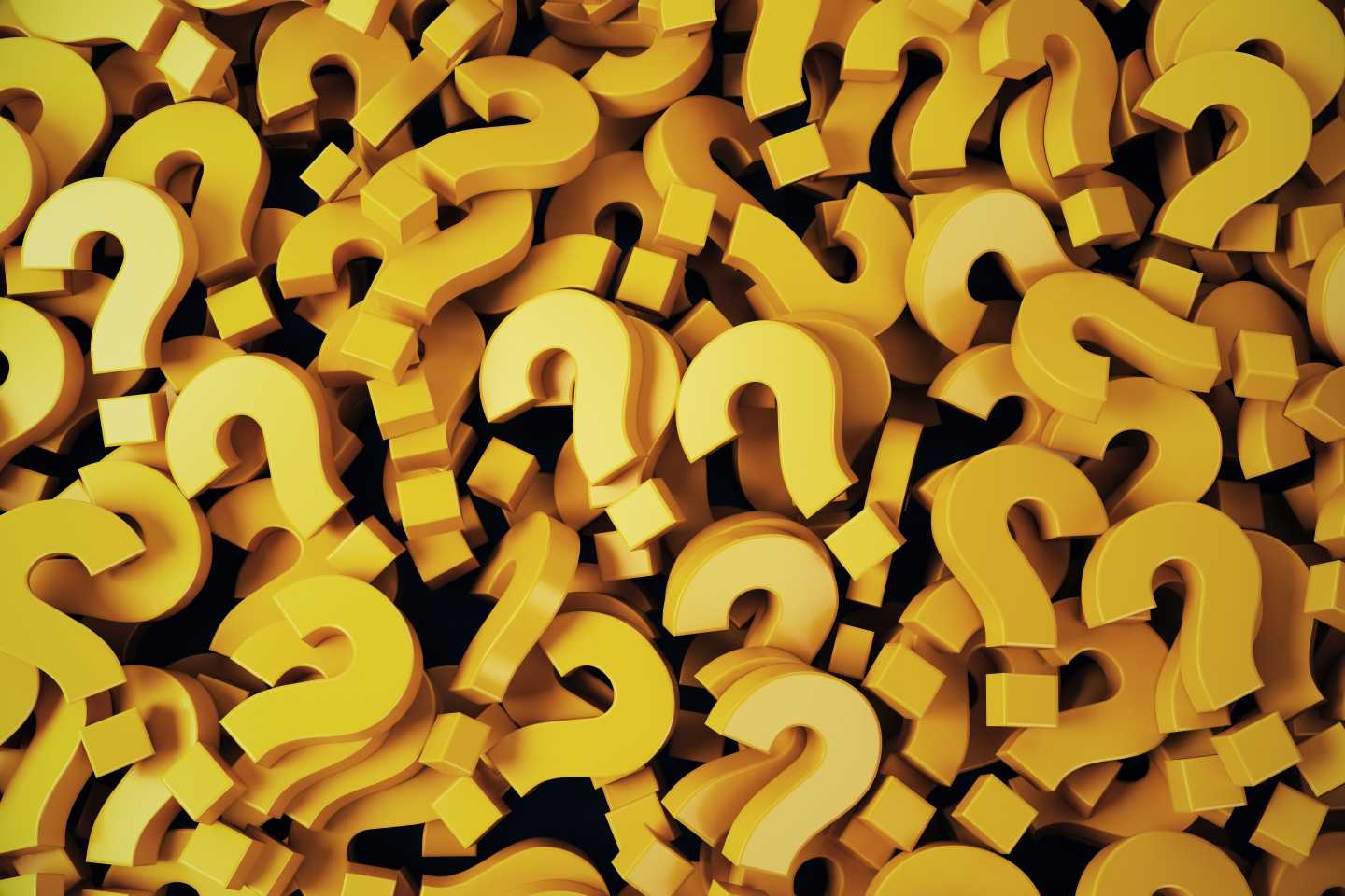 A pile of gold question marks.