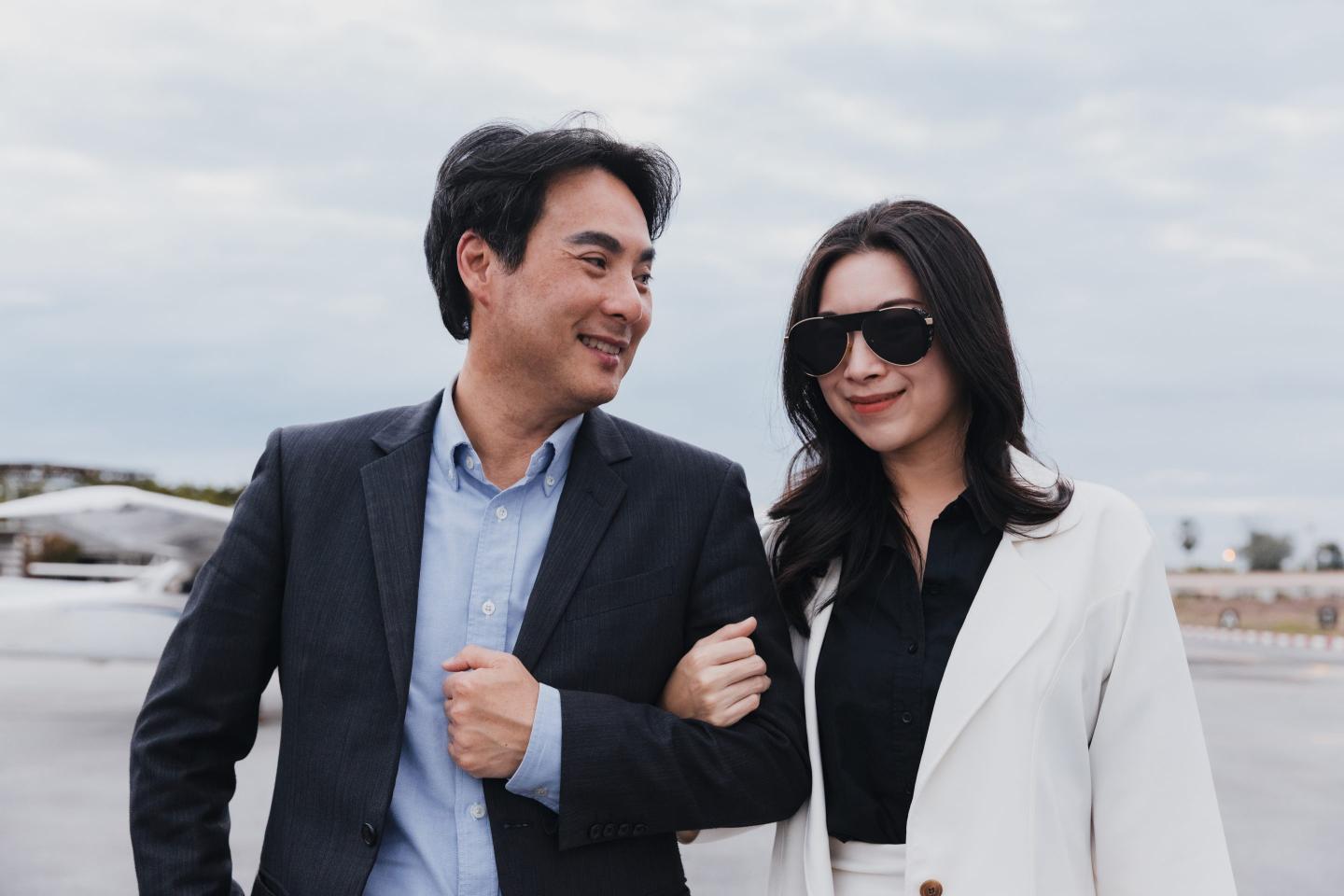 Rich couple walking